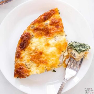 overhead of quiche slice with fork bite.
